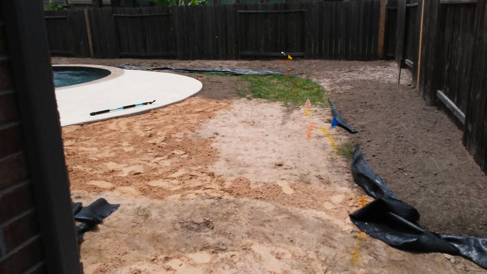 A Backyard Under Construction With A Pool