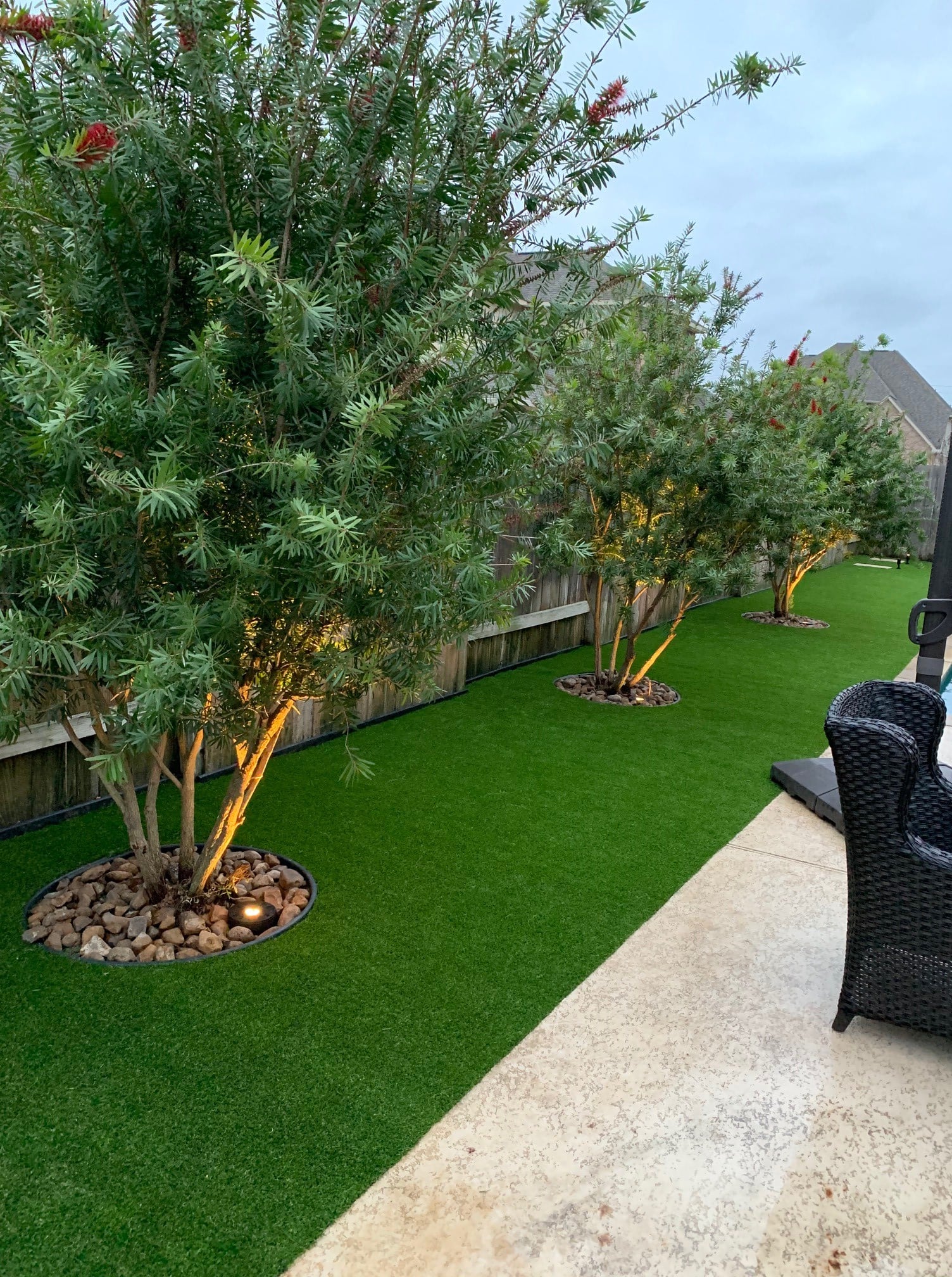 Artificial Grass Covering A Well-maintained Backyard