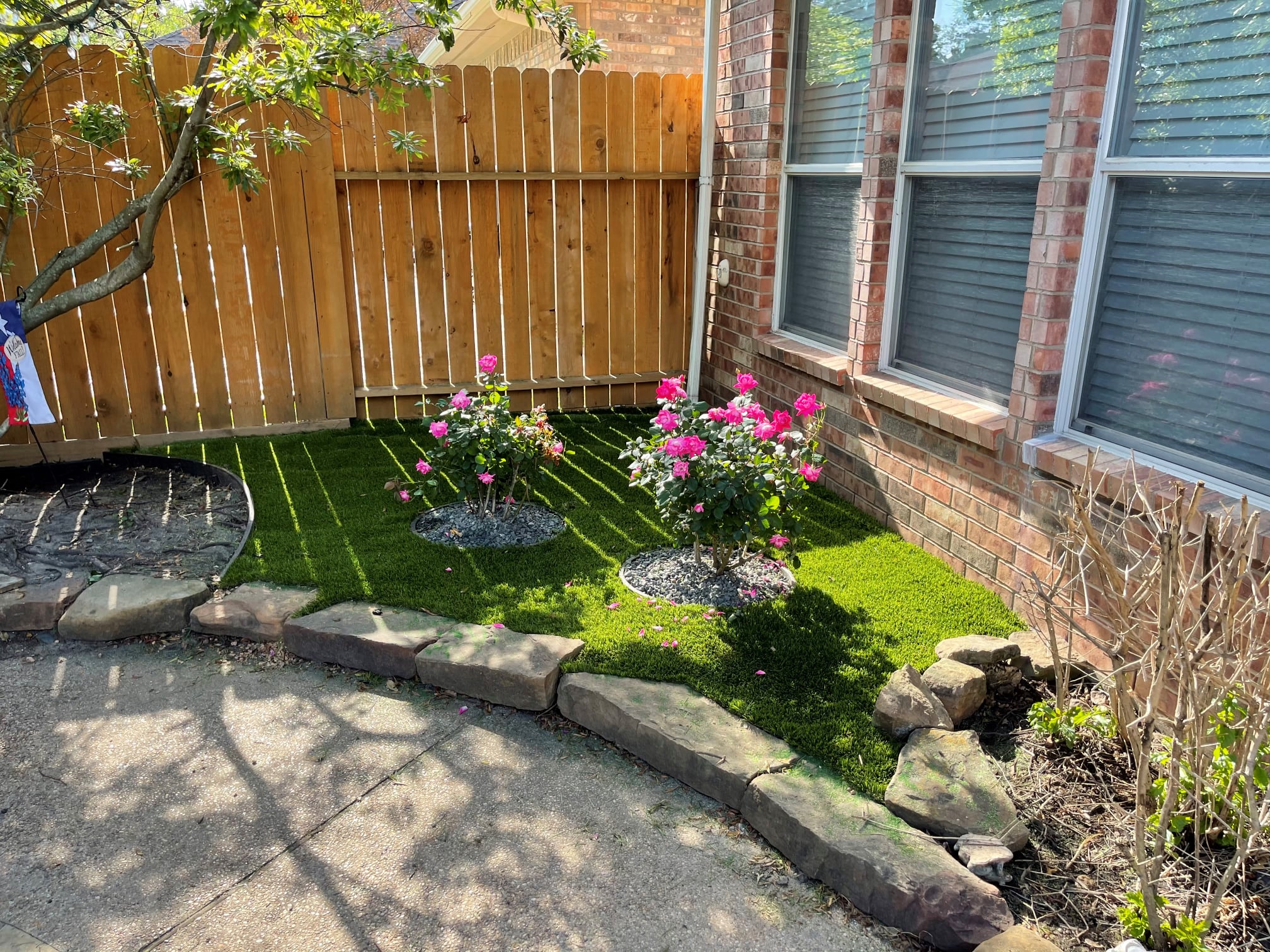 A Picturesque Backyard With A Lush Flower Bed